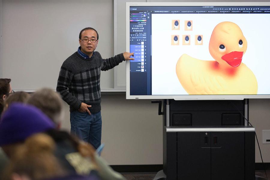 丹·金教授Adobe软件，屏幕上有一只黄色的鸭子.