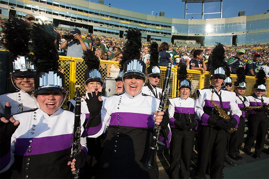 The 欧洲杯投注 Marching Band and Color Guard perform during a Packers game at Lambeau Field in Green Bay, Wisconsin.